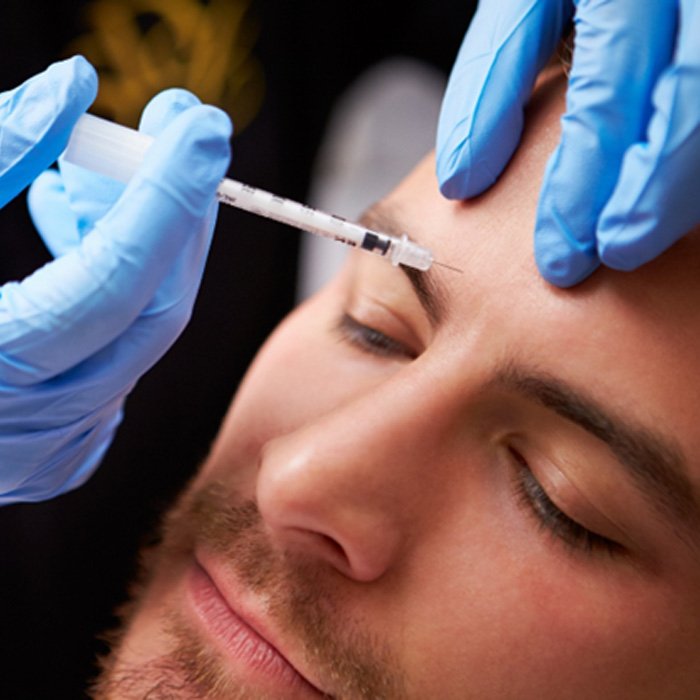 a man receiving BOTOX injections