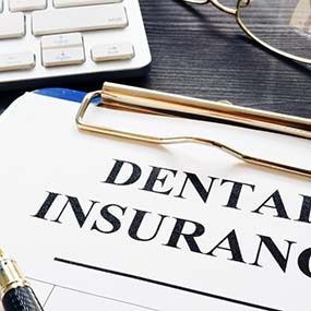 Dental insurance paperwork for the cost of dental implants in Lexington