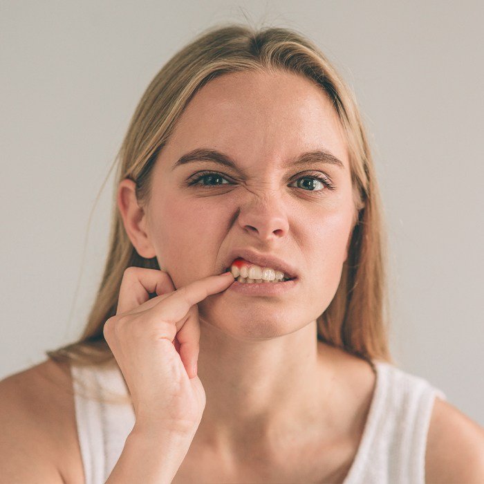 Woman with inflamed gum tissue