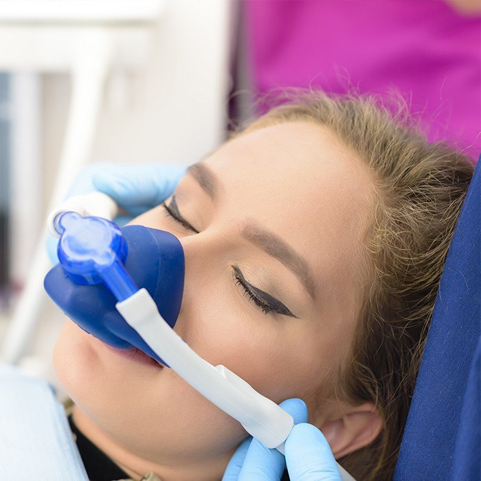 Woman with nitrous oxide mask
