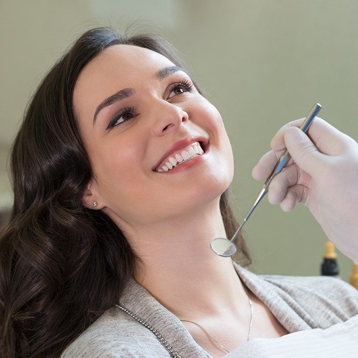 Smiling woman in dental chair