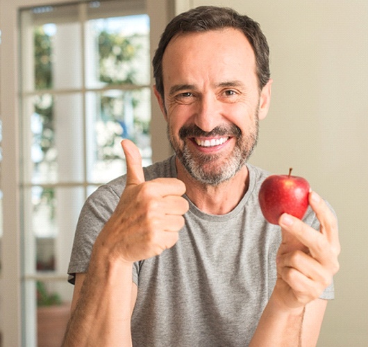 Man eating apple