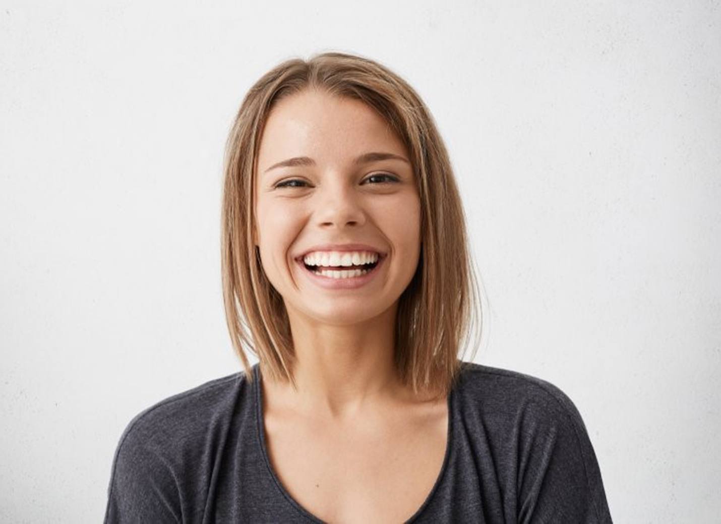 woman in black shirt smiling