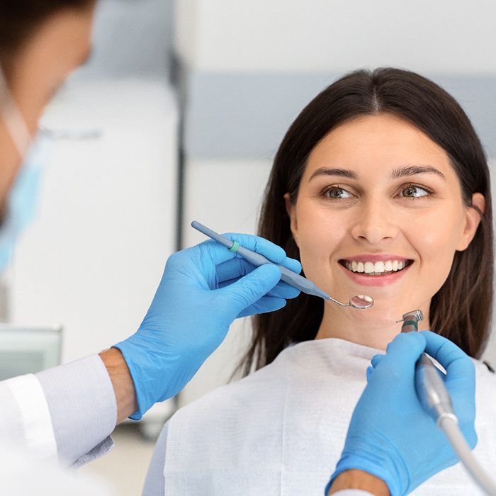 Woman listening to dentist in Lexington