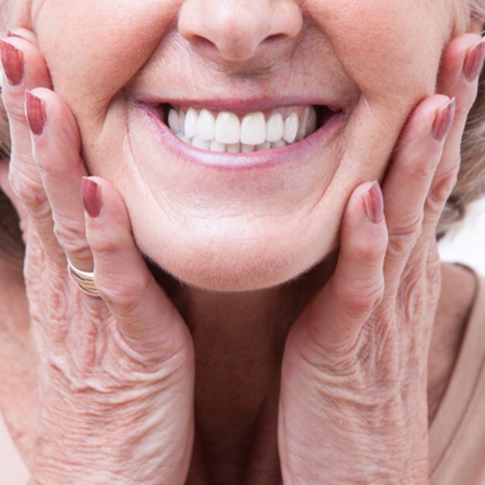 A closeup of an older woman’s dentures