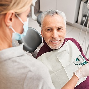 Man smiling at denture dentist in Lexington