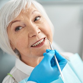Senior woman smiling at dentist