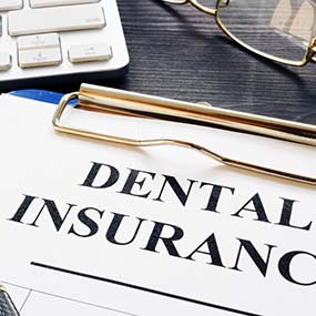 dental insurance paperwork for the cost of dental emergencies in Lexington