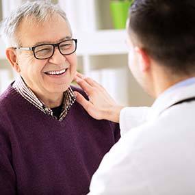 Patient and dentist discussing the cost of dental implants in Lexington