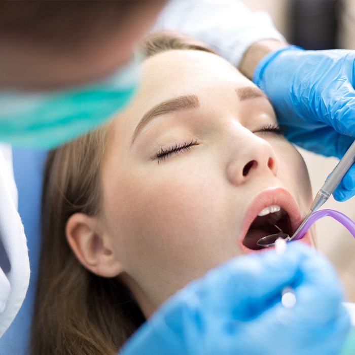 Woman receiving dental exam