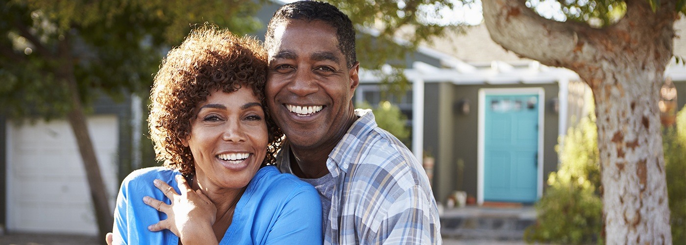 Man and woman smiling outdoors