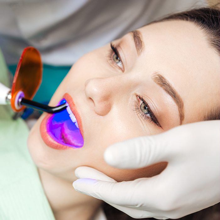 Patient receiving dental sealants