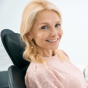 a patient smiling with dental implants in Lexington