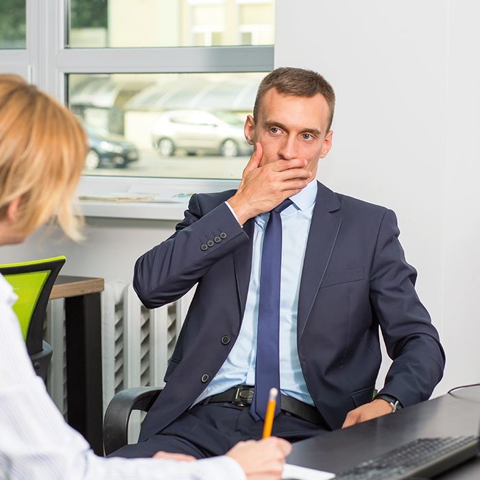 Man covering his mouth