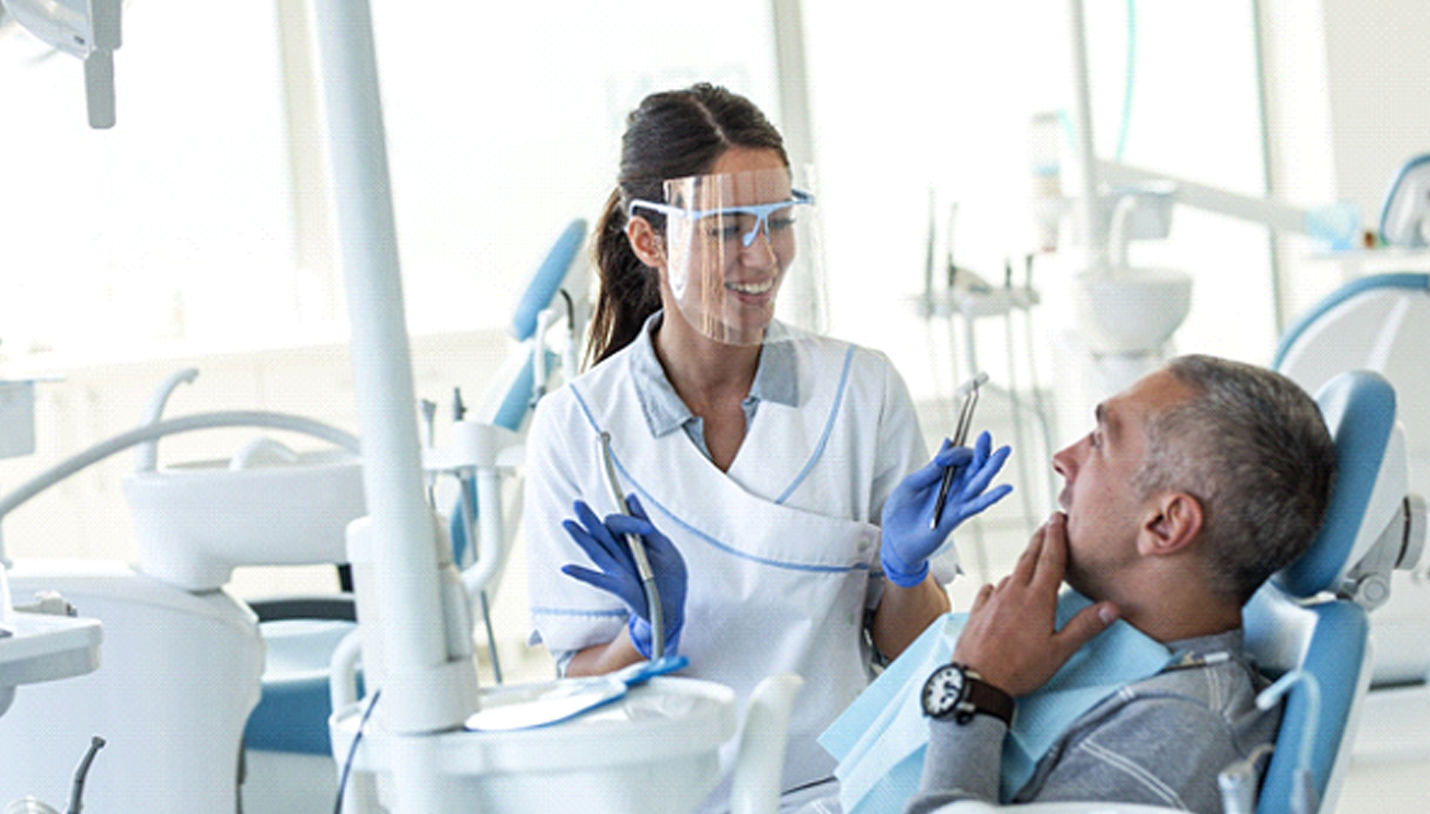 dentist in Lexington consulting with a patient about dental implants