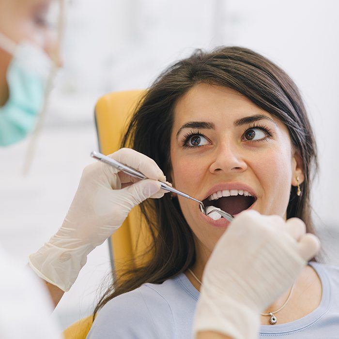 Woman receiving dental exam