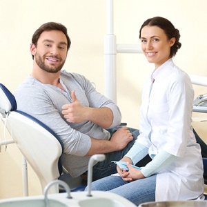 A male patient giving a thumbs up after successful sedation dentistry in Lexington