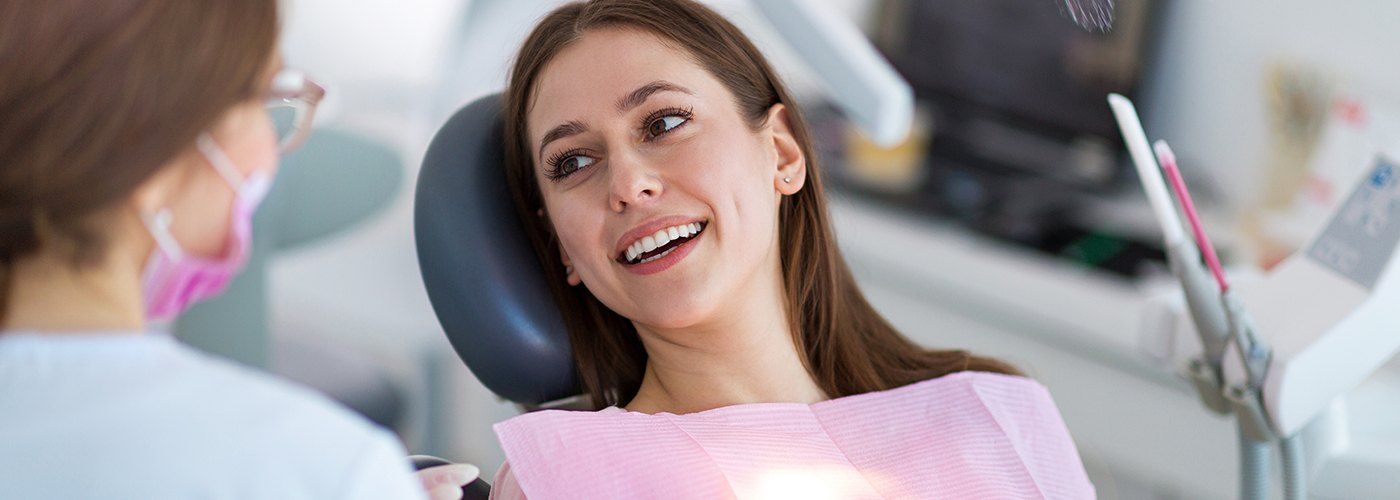 Smiling woman in dental chair