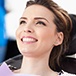 Woman in dental chair smiling