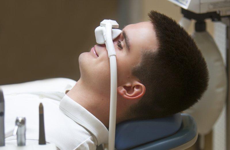 Male patient inhaling nitrous oxide