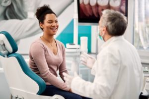patient and dentist talking during a dental implants consultation