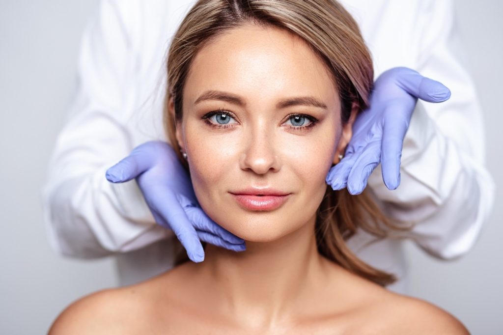 Woman smiling after receiving BOTOX treatment.