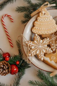 Candy cane and cookies on table