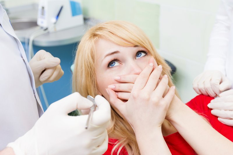 A woman suffering from dental anxiety